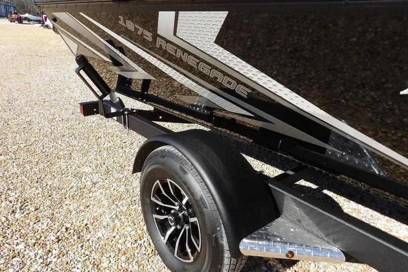 Slide: The Image of 2026 Lund 1875 Renegade boat on trailer, featuring sleek black design and modern graphics. - 42