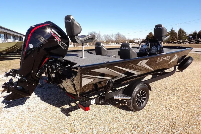 Slide: The Image of 2026 Lund 1875 Renegade boat with Mercury Pro XS engine on a trailer. - 9