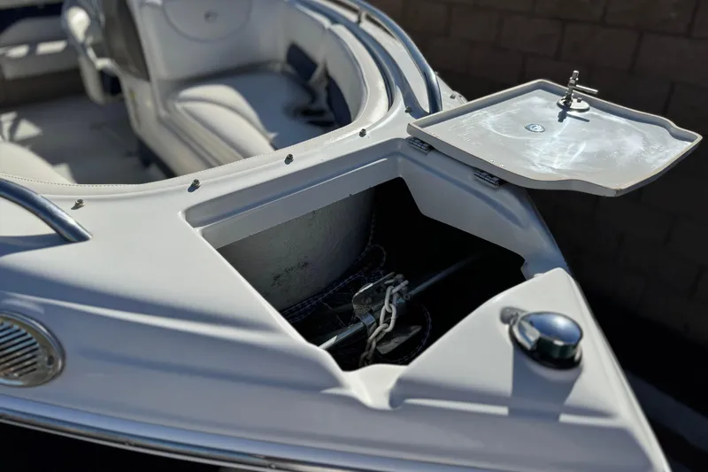 Slide: The Image of 2008 Crownline 21 SS boat with open anchor compartment and seating area. - 13