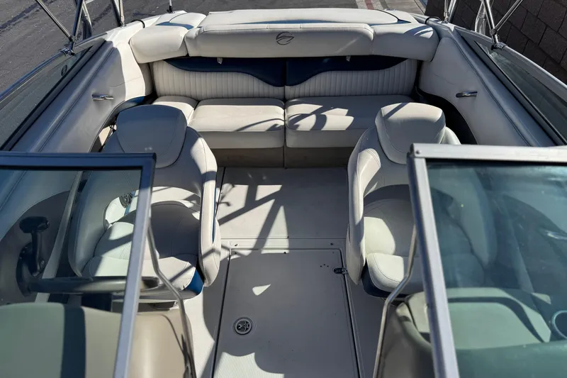 Slide: The Image of 2008 Crownline 21 SS boat interior with white seating and open cockpit design. - 17