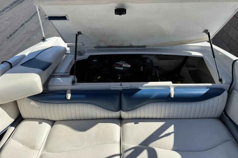 Slide: The Image of 2008 Crownline 21 SS boat engine compartment with open hatch, showcasing interior details. - 19