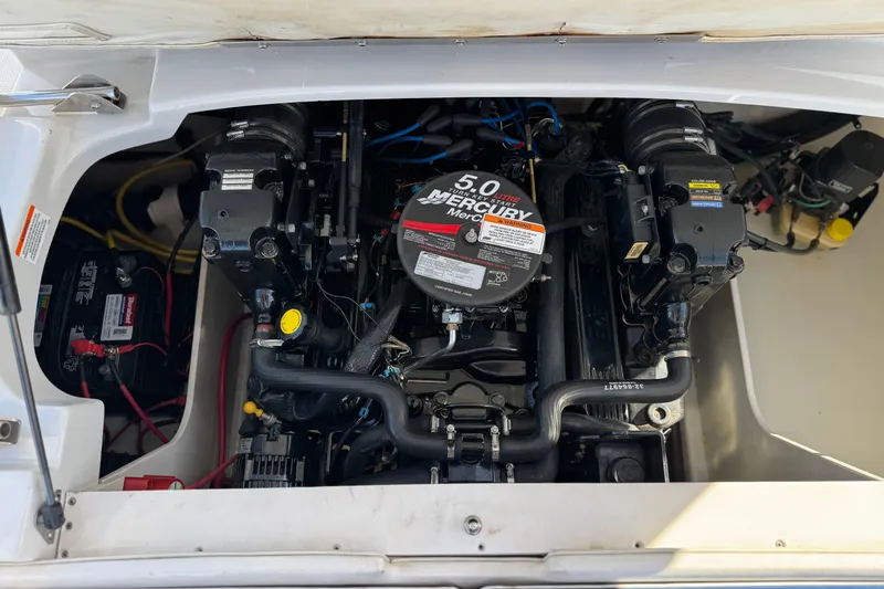 Slide: The Image of Engine compartment of a 2008 Crownline 21 SS boat with a 5.0L Mercury engine. - 20