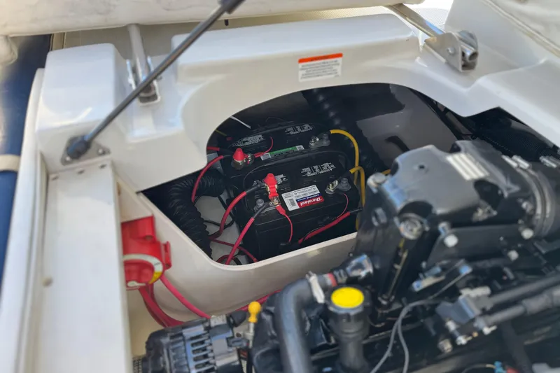 Slide: The Image of 2008 Crownline 21 SS boat engine compartment with batteries and wiring. - 21