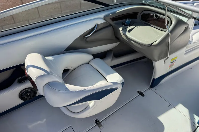 Slide: The Image of 2008 Crownline 21 SS boat interior with white and gray seating and dashboard. - 22