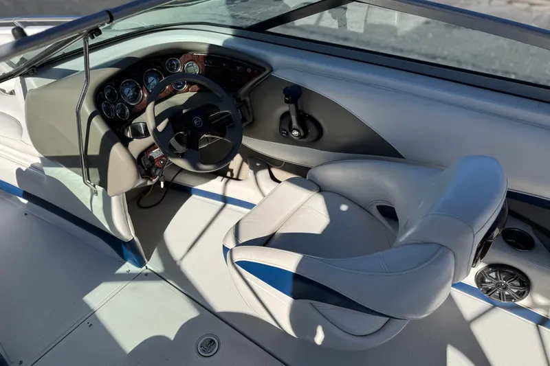 Slide: The Image of 2008 Crownline 21 SS boat interior with steering wheel and dashboard controls. - 24