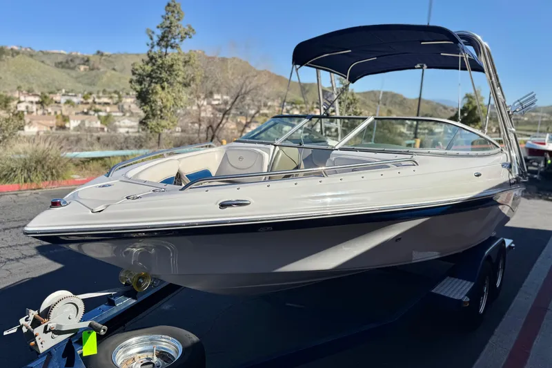 Slide: The Image of 2008 Crownline 21 SS boat on trailer, scenic background, sunny day. - 3