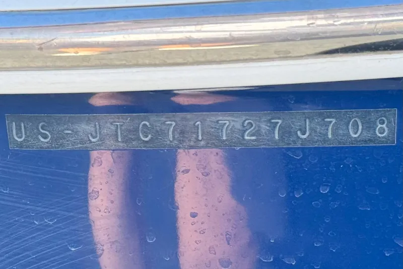 Slide: The Image of 2008 Crownline 21 SS boat hull identification number on blue surface. - 30