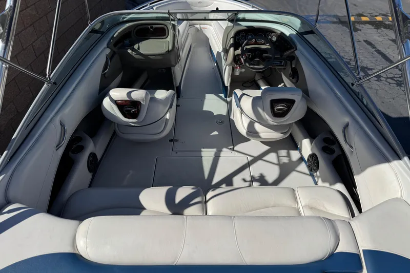 Slide: The Image of 2008 Crownline 21 SS boat interior with white seating and modern dashboard. - 8