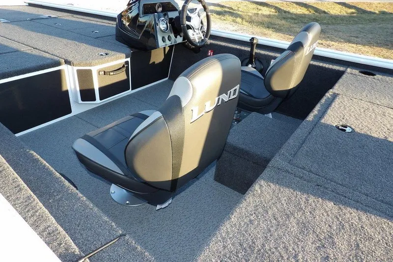 Slide: The Image of 2026 Lund 1875 Renegade boat interior with two seats and steering console. - 10