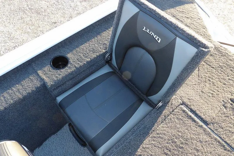 Slide: The Image of 2026 Lund 1875 Renegade boat seat with cup holder, featuring gray and black upholstery. - 15