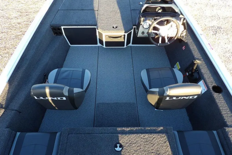 Slide: The Image of 2026 Lund 1875 Renegade boat interior with dual seats and steering console. - 22