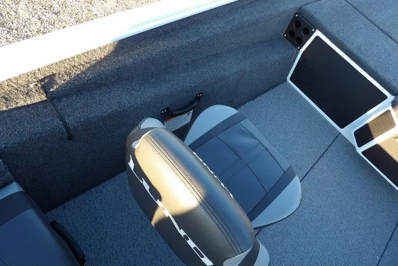 Slide: The Image of 2026 Lund 1875 Renegade boat interior with gray seating and carpeted flooring. - 24