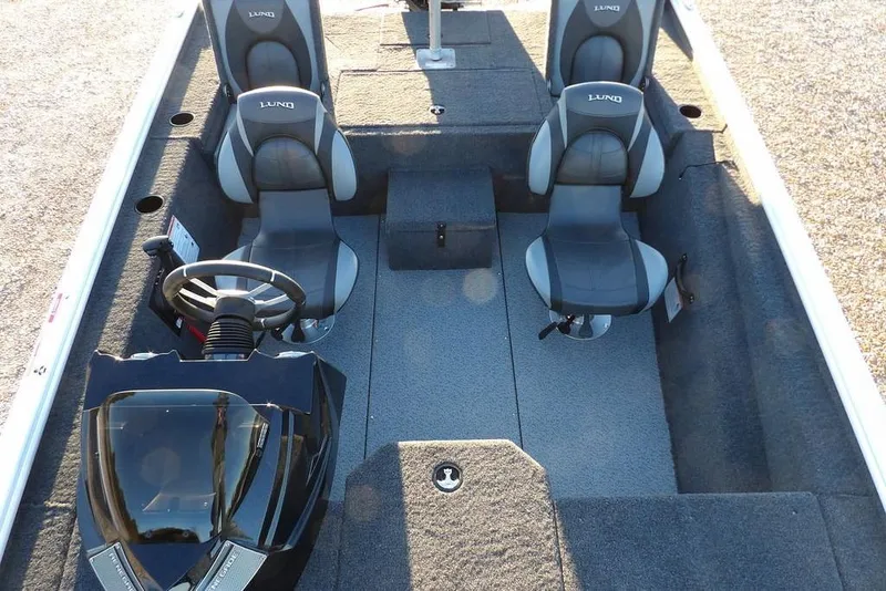 Slide: The Image of 2026 Lund 1875 Renegade boat interior with dual seats and steering console. - 25