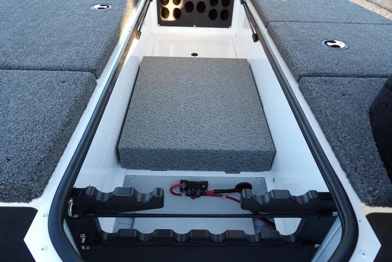 Slide: The Image of 2026 Lund 1875 Renegade boat interior with storage compartments and cushioned seating. - 30