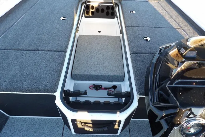 Slide: The Image of 2026 Lund 1875 Renegade boat interior with storage compartments and motor detail. - 31