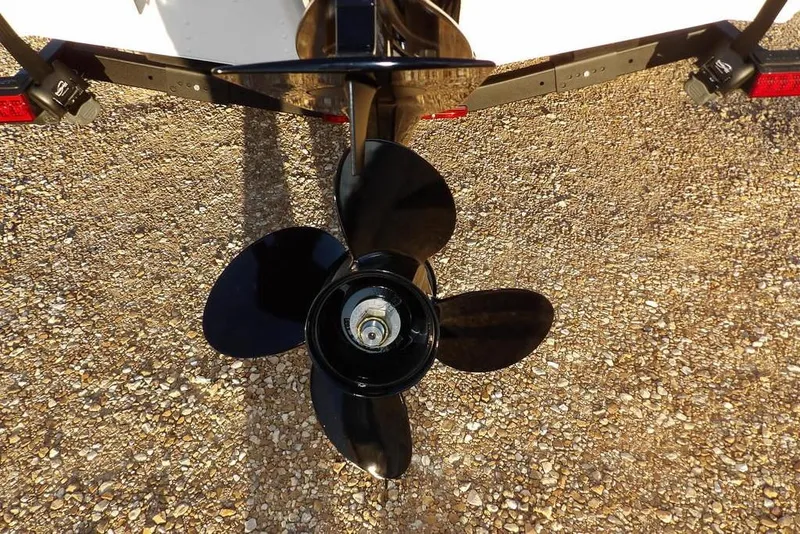 Slide: The Image of Propeller of 2026 Lund 1875 Renegade boat on gravel surface. - 42