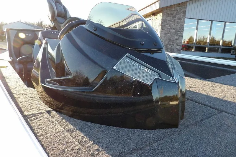 Slide: The Image of 2026 Lund 1875 Renegade boat, sleek design, black finish, outdoor setting. - 45