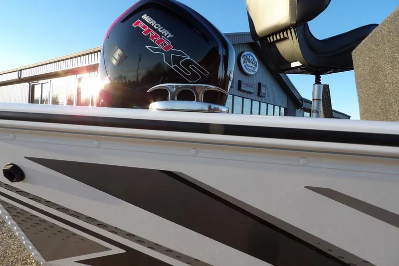 Slide: The Image of 2026 Lund 1875 Renegade boat with Mercury Pro XS engine, outdoor dealership view. - 47
