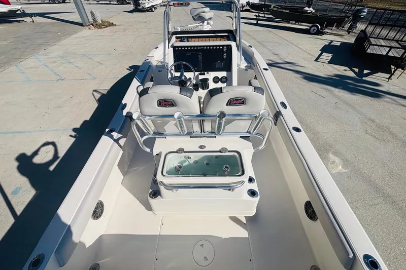 Slide: The Image of 2021 Ranger 2510 Bay boat interior with dual seats and control panel. - 12