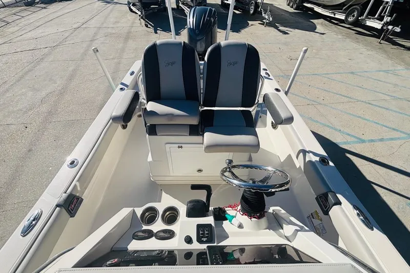 Slide: The Image of 2021 Ranger 2510 Bay boat interior with dual seats and steering wheel. - 13