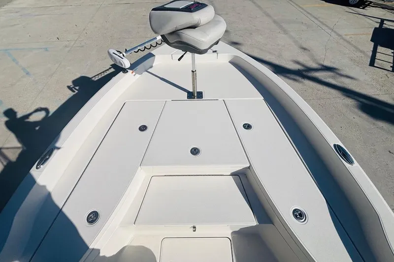 Slide: The Image of 2021 Ranger 2510 Bay boat deck with seating and storage compartments. - 15