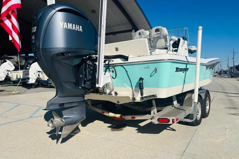Slide: The Image of 2021 Ranger 2510 Bay boat with Yamaha outboard motor on trailer. - 2