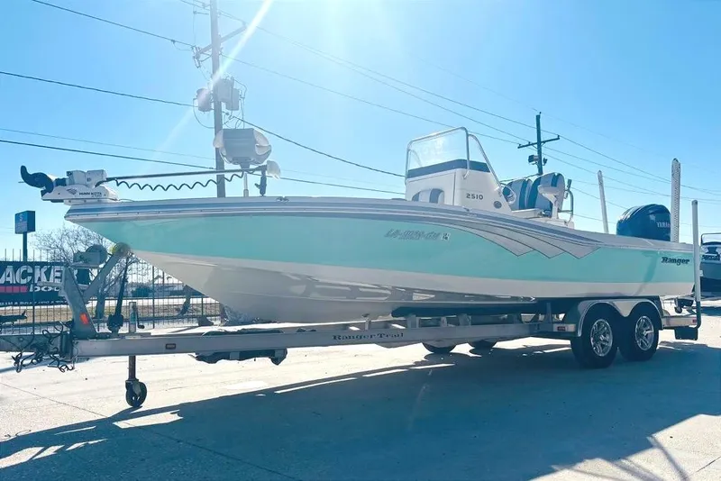 Slide: The Image of 2021 Ranger 2510 Bay boat on trailer in sunlight. - 6