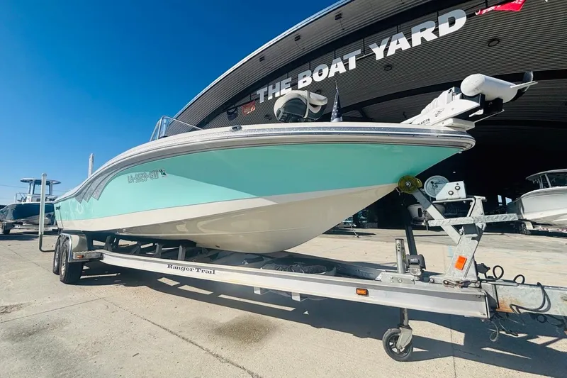 Slide: The Image of 2021 Ranger 2510 Bay boat on trailer at The Boat Yard dealership. - 9