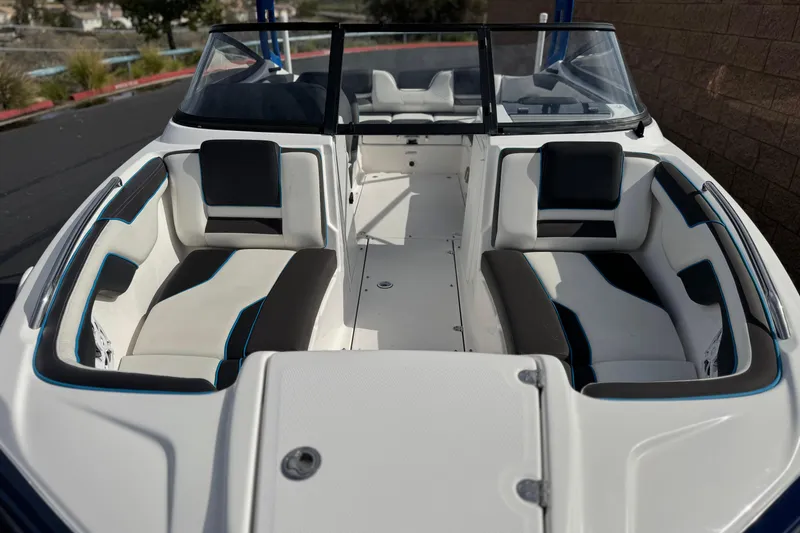 Slide: The Image of 2020 Yamaha Boats AR210 interior with sleek seating and modern design. - 12