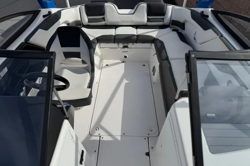 Slide: The Image of 2020 Yamaha Boats AR210 interior with seating and steering wheel, showcasing modern design. - 17