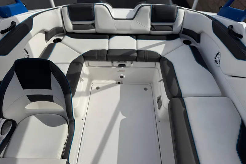 Slide: The Image of 2020 Yamaha Boats AR210 interior with spacious seating and modern design. - 18