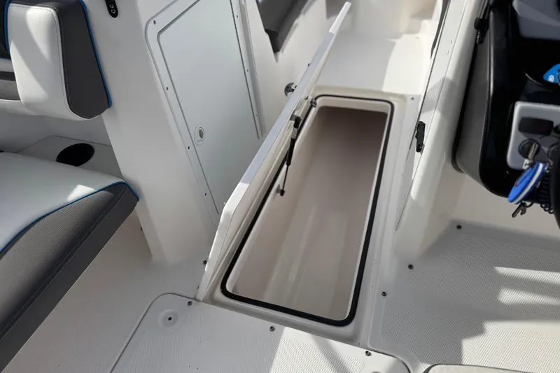 Slide: The Image of 2020 Yamaha AR210 boat interior with open storage compartment. - 21