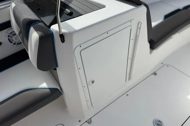 Slide: The Image of 2020 Yamaha AR210 boat interior with sleek seating and storage compartment. - 23
