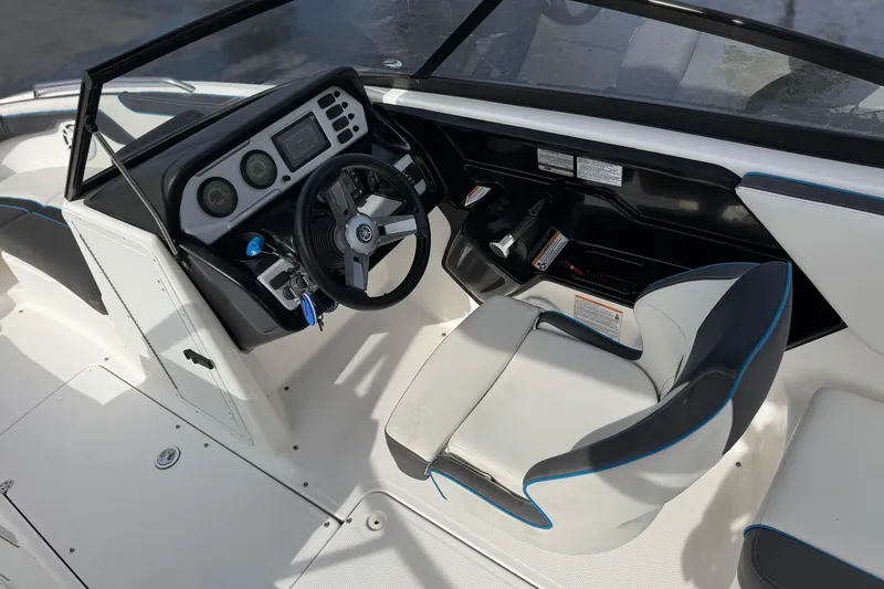 Slide: The Image of 2020 Yamaha Boats AR210 cockpit with steering wheel and control panel. - 25