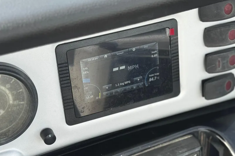 Slide: The Image of Dashboard of a 2020 Yamaha AR210 boat showing speed and fuel indicators. - 27