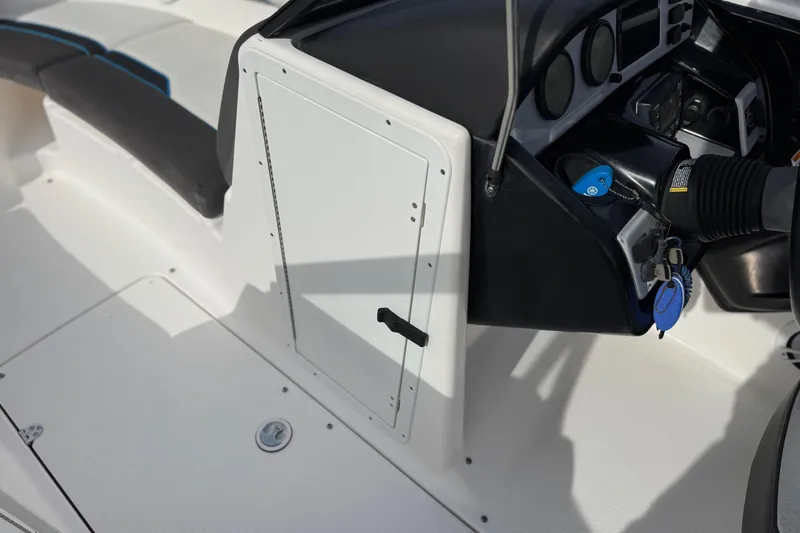 Slide: The Image of 2020 Yamaha AR210 boat cockpit with steering wheel and control panel. - 30