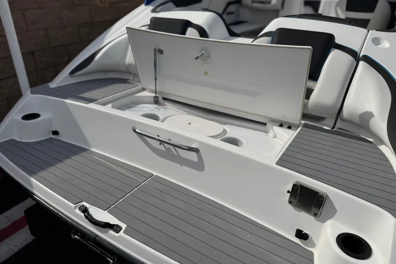 Slide: The Image of 2020 Yamaha Boats AR210 swim platform with storage compartment open. - 7