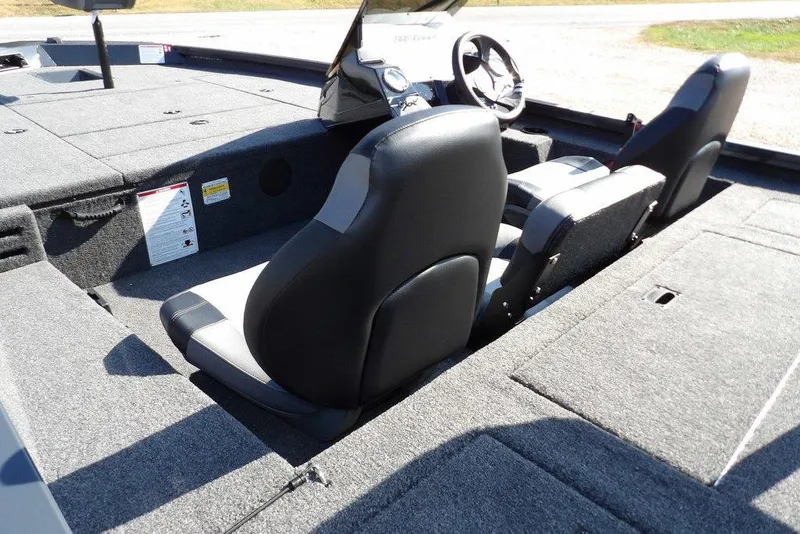 Slide: The Image of 2026 Crestliner XFC 189 boat interior with dual seats and steering wheel. - 10