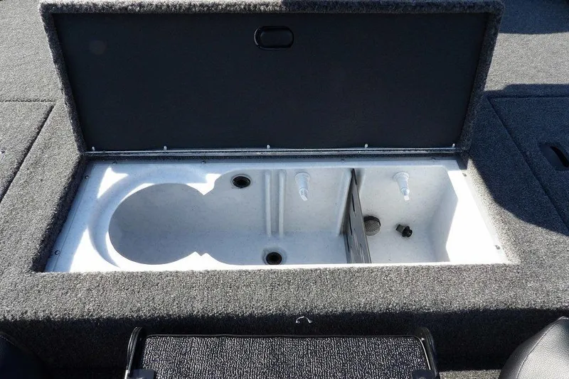 Slide: The Image of 2026 Crestliner XFC 189 boat livewell with open lid, showcasing interior compartments. - 13