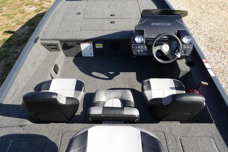 Slide: The Image of 2026 Crestliner XFC 189 boat interior with steering console and seating arrangement. - 18