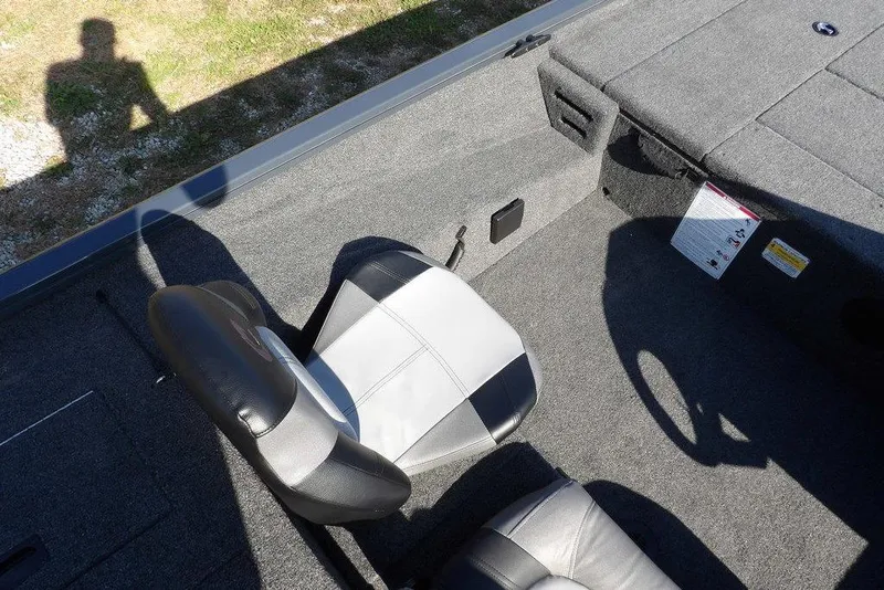 Slide: The Image of Interior of 2026 Crestliner XFC 189 boat with gray seating and carpet. - 20