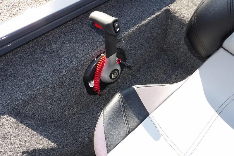 Slide: The Image of 2026 Crestliner XFC 189 boat interior with throttle control and cushioned seating. - 21