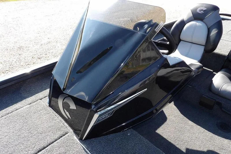 Slide: The Image of 2026 Crestliner XFC 189 boat console with sleek black design and comfortable seating. - 24