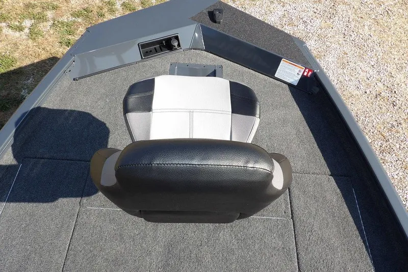 Slide: The Image of 2026 Crestliner XFC 189 boat interior with cushioned seat and carpeted flooring. - 28