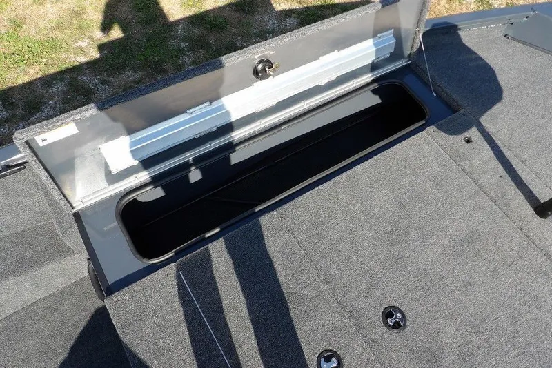 Slide: The Image of Open storage compartment on 2026 Crestliner XFC 189 boat, showcasing interior space. - 30