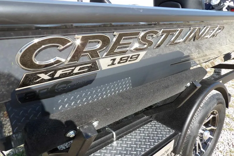 Slide: The Image of 2026 Crestliner XFC 189 boat logo on metallic surface. - 40