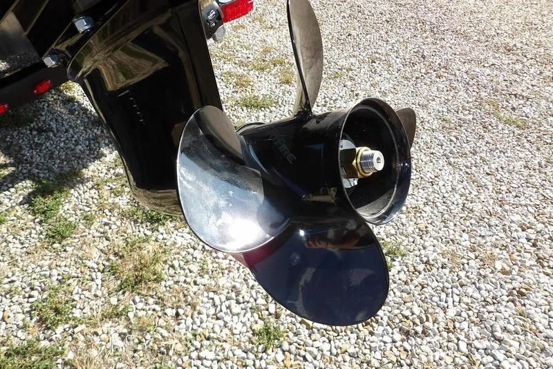 Slide: The Image of 2026 Crestliner XFC 189 boat propeller on gravel surface. - 42