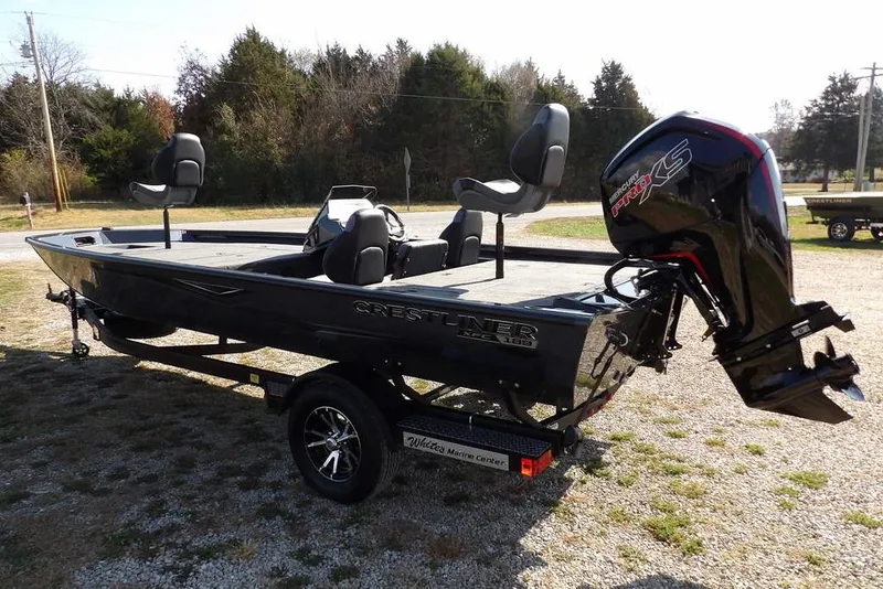 Slide: The Image of 2026 Crestliner XFC 189 fishing boat with Mercury Pro XS engine on a trailer. - 7