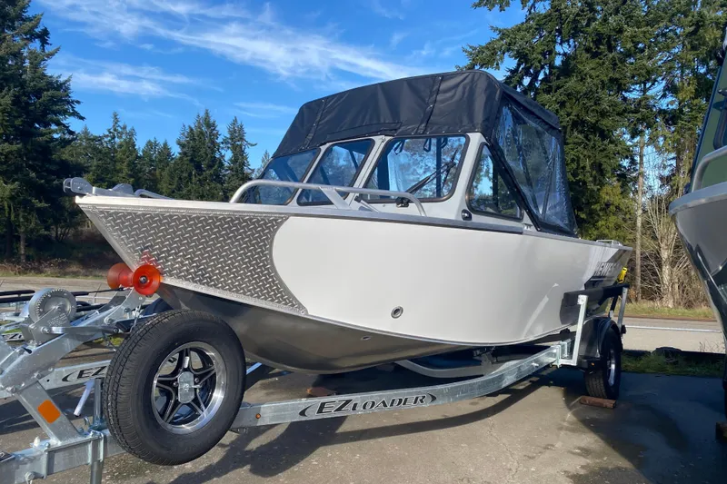 The Image of 2026 Hewescraft 180 Sportsman on trailer outdoors. - 0