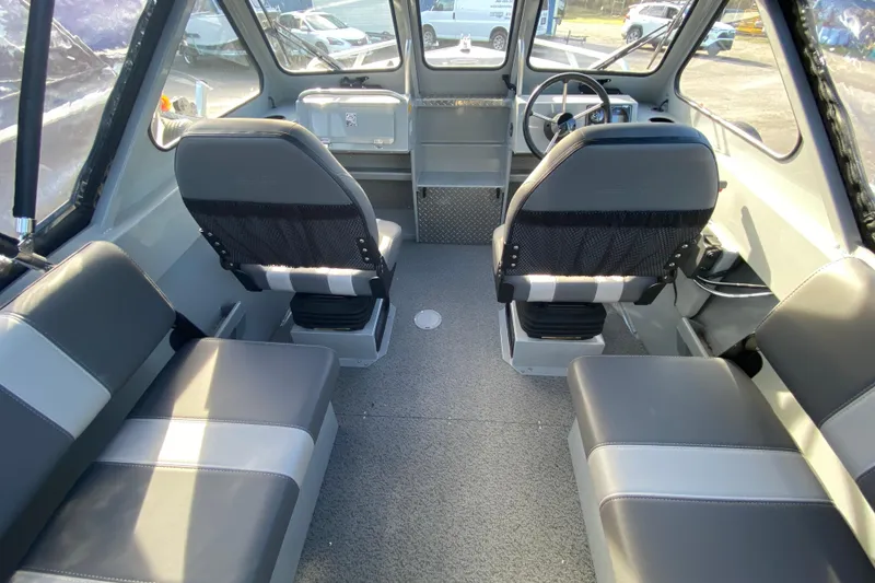 Slide: The Image of Interior of 2026 Hewescraft 180 Sportsman with gray seating. - 10